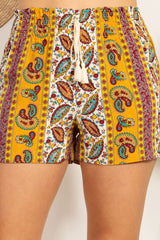 Wholesale Womens Rayon Challis Smocked Waist Paperbag Shorts With Tassel Tie Detail - Yellow Multicolor Boho Paisley Print